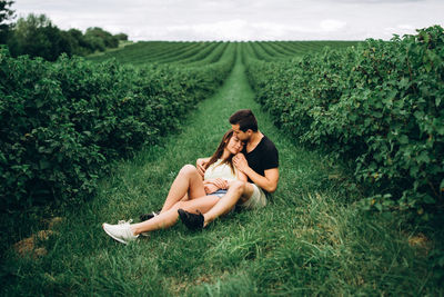 Woman sitting on field