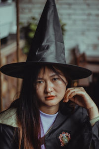 Portrait of young woman wearing hat