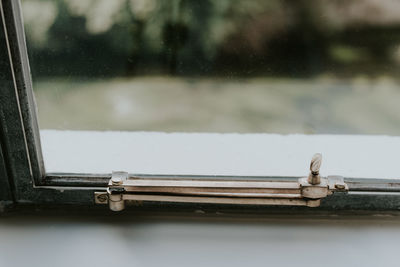 Close-up of closed glass window