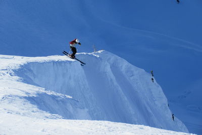 Low angle view of man skiing on  mountain 
