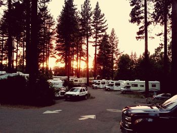 Cars on road in city against sky