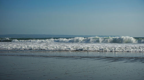 Scenic view of sea against clear sky