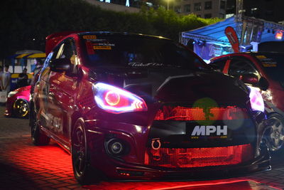 Close-up of vintage car on street at night