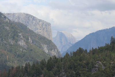 Scenic view of mountains against cloudy sky