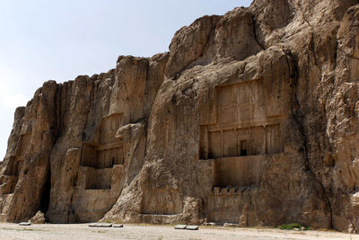 Low angle view of rock formation against sky