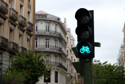 Low angle view of road sign against sky