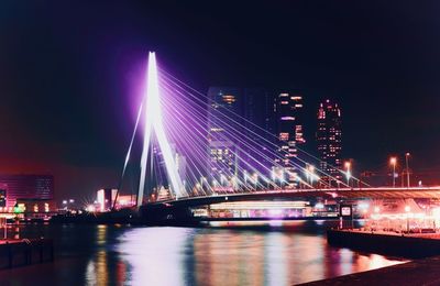 Erasmus bridge lit up in cyberpunk style purple glow rotterdam, edited photo