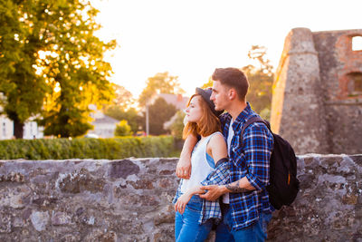 Young couple standing outdoors