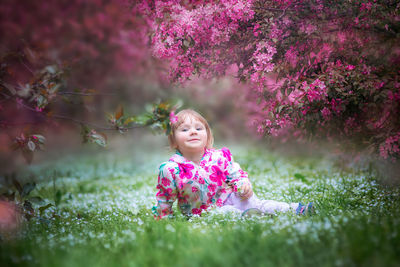 Girl with pink flowers on tree