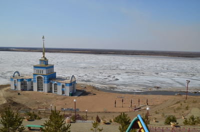 Scenic view of beach by sea against sky