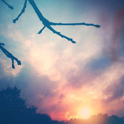 Low angle view of cloudy sky at sunset