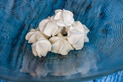 Meringue in an big bowl on blue background