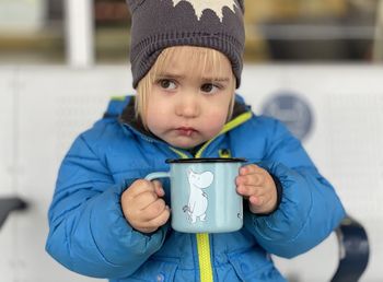 Portrait of cute boy in snow