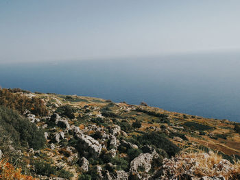 High angle view of sea and mountains against sky