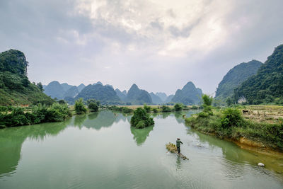 Panoramic view of lake and mountains against sky