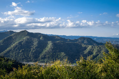 High angle view of trees and mountains against sky