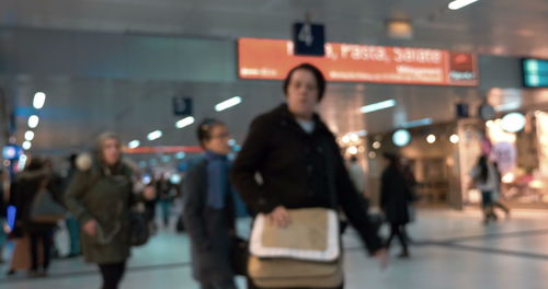 Group of people walking on airport