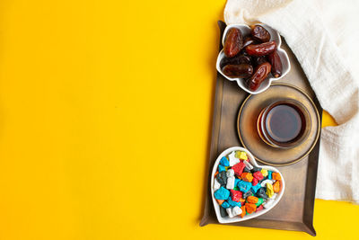 High angle view of multi colored glass on table