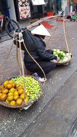 Man working on street at market stall