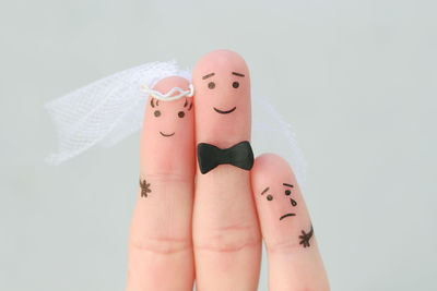 Fingers art of happy couple to get married. concept of stepson vs wedding.