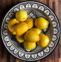 High angle view of lemon in plate on table