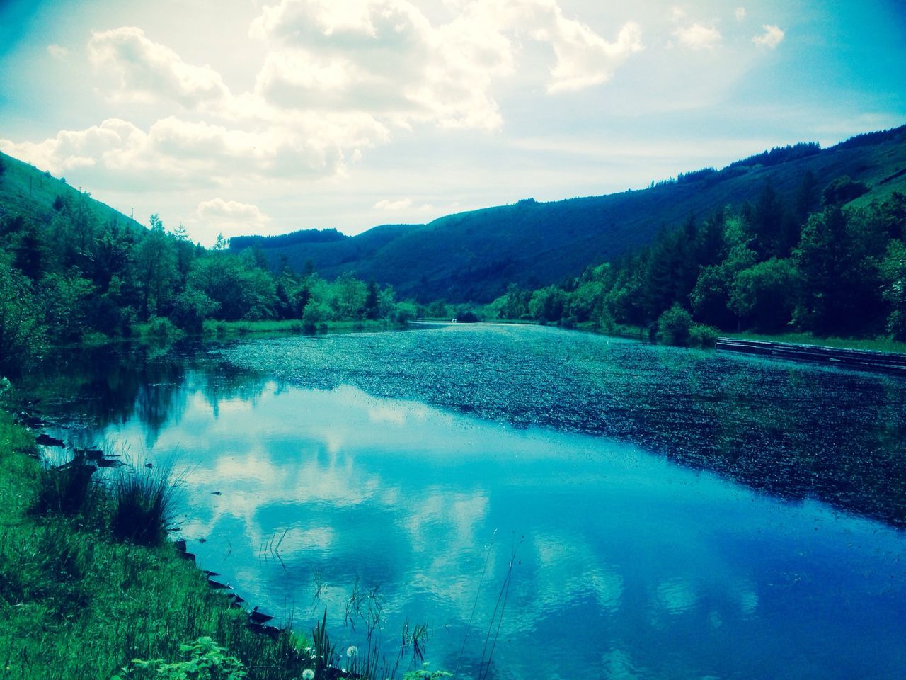 water, mountain, tranquil scene, sky, tranquility, scenics, lake, beauty in nature, reflection, cloud - sky, nature, mountain range, tree, cloud, idyllic, blue, landscape, non-urban scene, day, calm