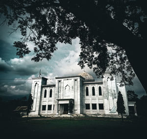 Low angle view of old building against sky