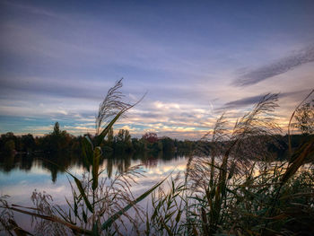 Scenic view of lake against sky during sunset