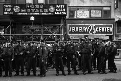 People looking at city street