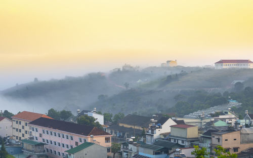 High angle view of townscape against sky during sunset