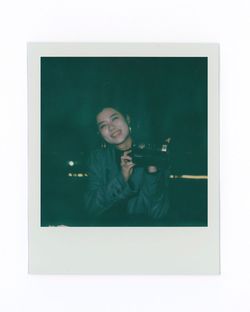 Portrait of happy woman photographing