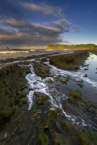 Scenic view of sea against sky during sunset