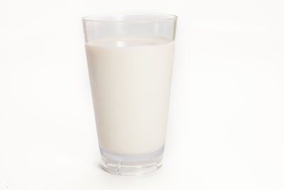 Close-up of drink in glass against white background