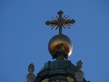 Low angle view of statue against clear blue sky