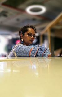 Portrait of woman sitting at table