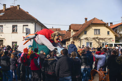 People at town square against sky