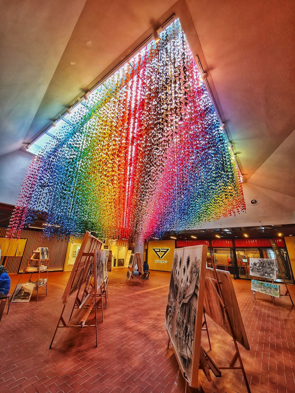 MULTI COLORED UMBRELLA ON WOODEN FLOOR