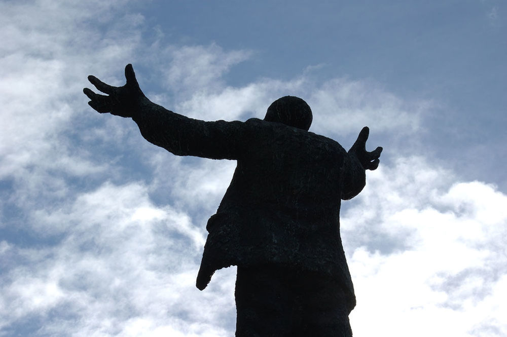 cloud - sky, sky, silhouette, sculpture, statue, low angle view, representation, art and craft, nature, mammal, day, gesturing, human representation, one animal, domestic animals, creativity, animal wildlife, human arm, arms raised