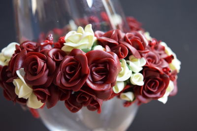 Close-up of rose decoration on wine glass