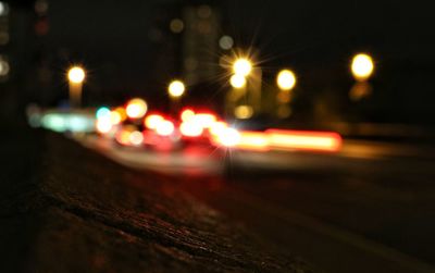 Defocused image of illuminated street lights at night