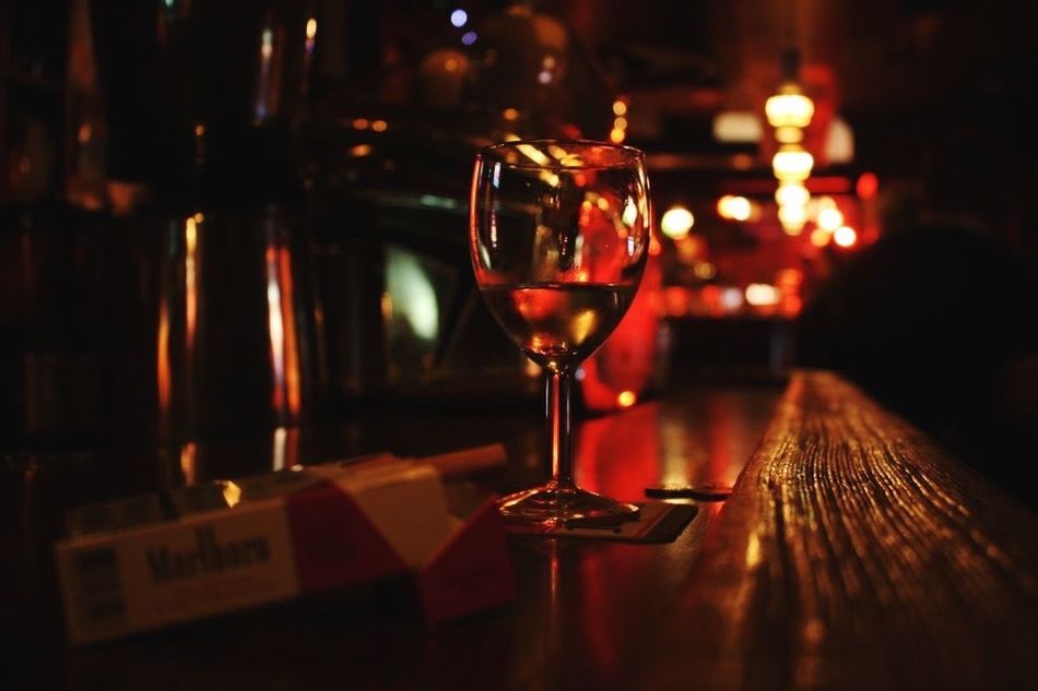 indoors, table, still life, drink, food and drink, focus on foreground, illuminated, close-up, drinking glass, selective focus, candle, wineglass, refreshment, glass - material, restaurant, alcohol, wood - material, night, no people, freshness