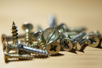 Close-up of screw on table