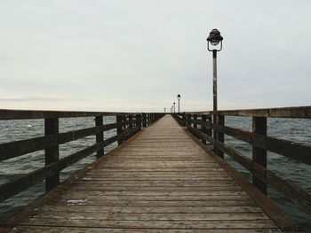 Pier on sea against sky