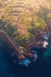 High angle view of rocks by sea