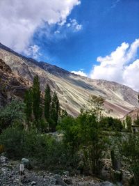 Scenic view of landscape and mountains against sky