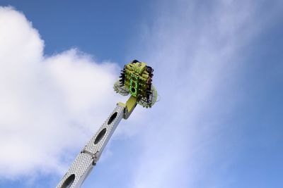 Low angle view of caterpillar on plant against sky
