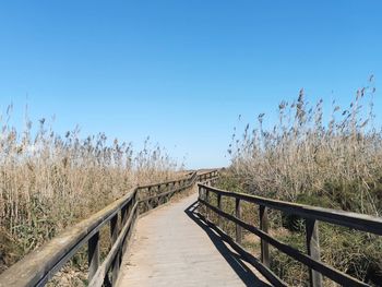 View of bridge against clear blue sky