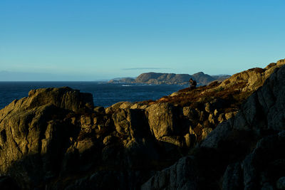 Scenic view of sea against clear blue sky