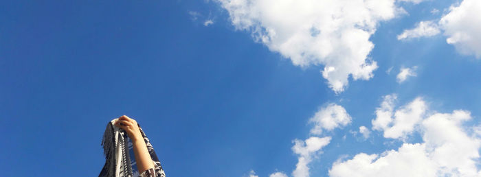 Low angle view of statue against blue sky