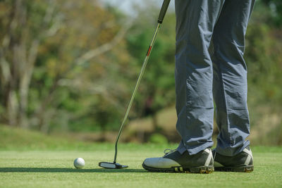 Low section of man on golf course